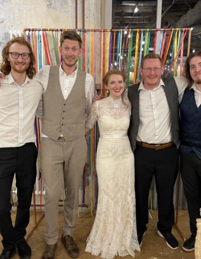the team with the bride during event