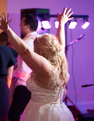 The bride happily dancing the tune